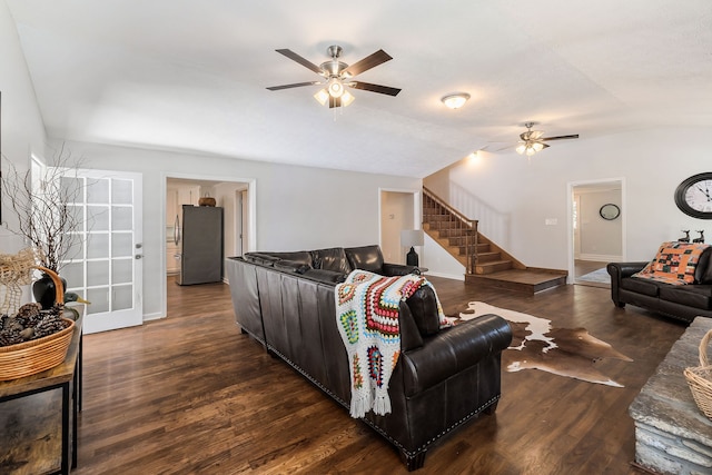 living room featuring lofted ceiling, dark hardwood / wood-style floors, and ceiling fan