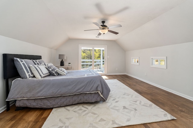 bedroom featuring lofted ceiling, access to exterior, dark wood-type flooring, and ceiling fan