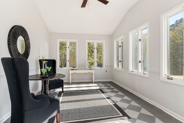 sunroom / solarium with french doors, ceiling fan, a healthy amount of sunlight, and lofted ceiling