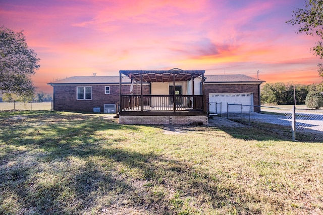 ranch-style home with a yard, a pergola, a deck, and a garage