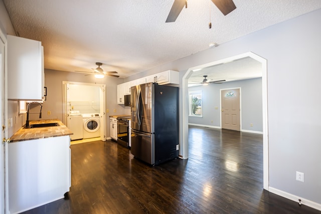 kitchen with sink, wood counters, stainless steel appliances, white cabinets, and dark hardwood / wood-style floors