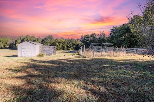 yard at dusk with an outbuilding