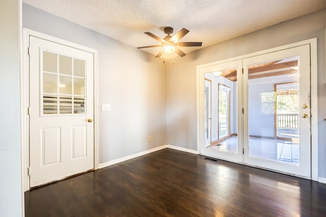 entryway featuring dark hardwood / wood-style floors, a textured ceiling, and ceiling fan