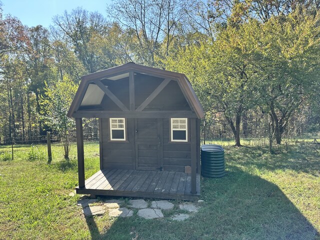 view of outbuilding featuring a lawn