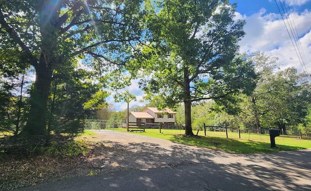 view of property's community with a lawn