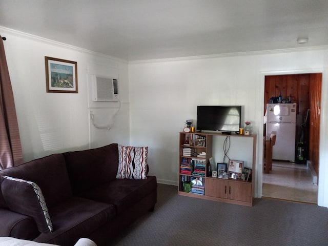 living room with ornamental molding and carpet