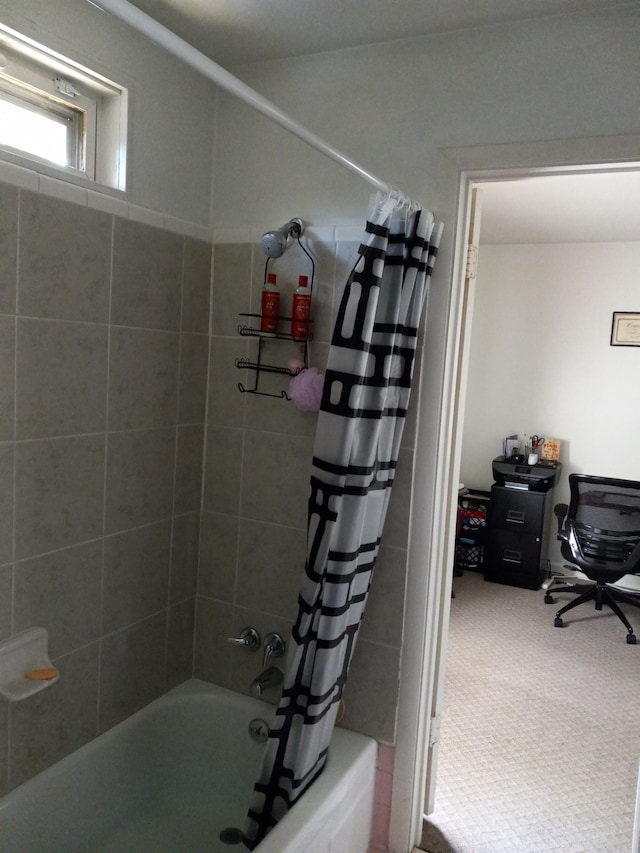 bathroom with shower / bathtub combination with curtain