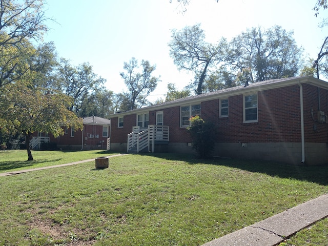 ranch-style house with a front lawn