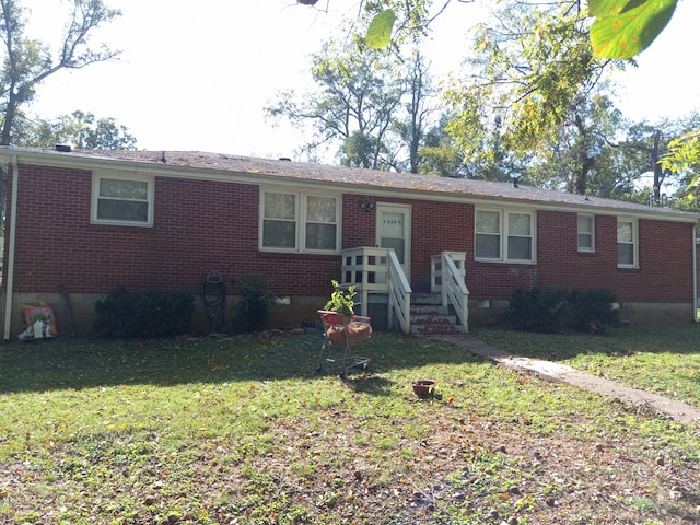 ranch-style house with a front lawn