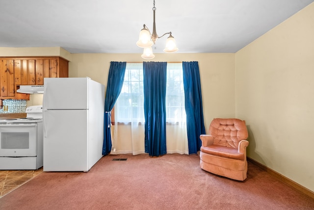 kitchen with white appliances, light carpet, decorative light fixtures, and a chandelier