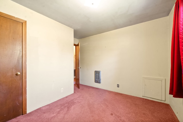 carpeted spare room with heating unit