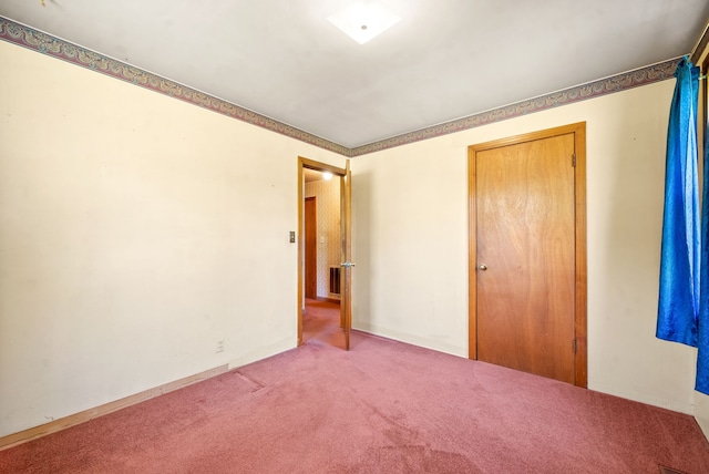 unfurnished bedroom with carpet floors