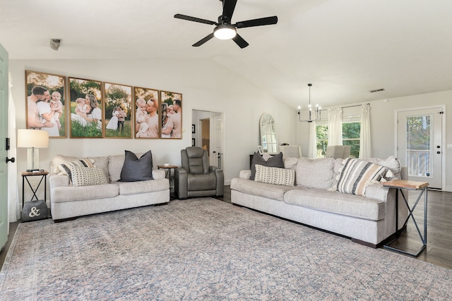 living room with vaulted ceiling, dark hardwood / wood-style floors, and ceiling fan with notable chandelier