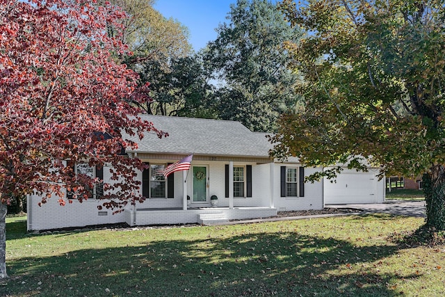 view of front facade with a garage and a front lawn