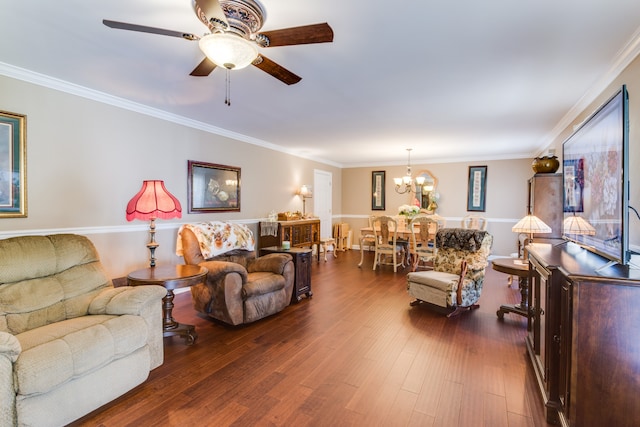 living room featuring ornamental molding, dark hardwood / wood-style floors, and ceiling fan with notable chandelier