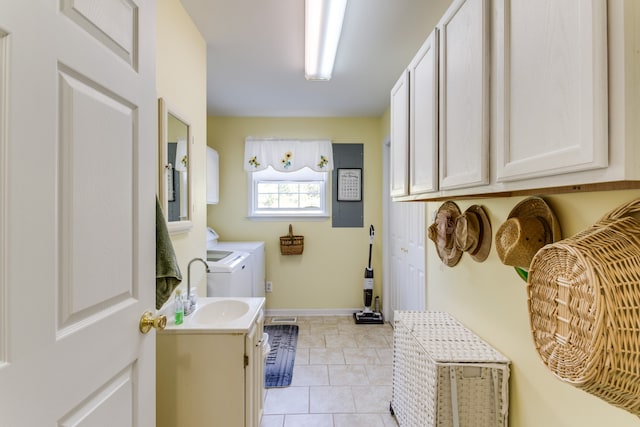 bathroom featuring vanity, washing machine and dryer, and tile patterned flooring