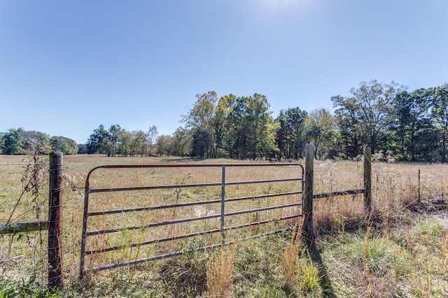 view of gate featuring a rural view