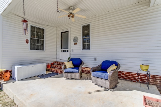 view of patio featuring ceiling fan