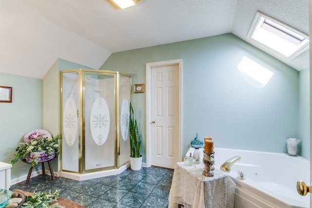 bathroom with vaulted ceiling with skylight, a textured ceiling, and separate shower and tub