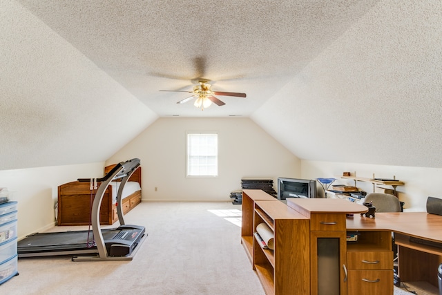 office with vaulted ceiling, light carpet, a textured ceiling, and ceiling fan