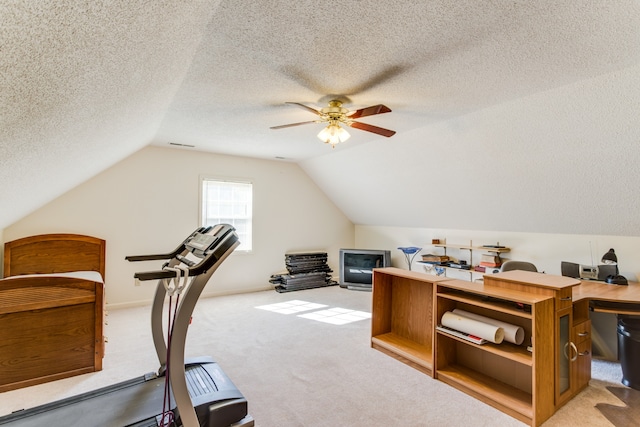 office featuring light carpet, a textured ceiling, ceiling fan, and vaulted ceiling