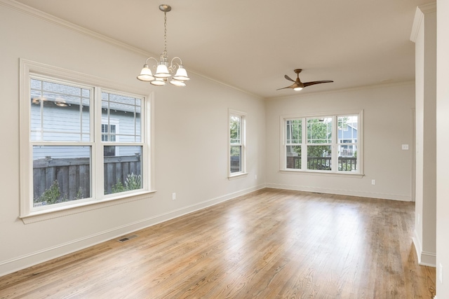 spare room with light hardwood / wood-style floors, ornamental molding, and ceiling fan with notable chandelier