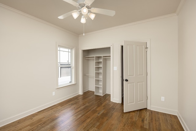 unfurnished bedroom featuring ornamental molding, dark wood-type flooring, and ceiling fan