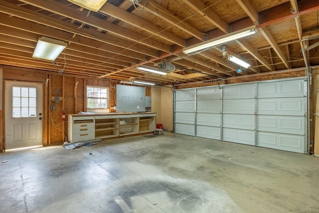 garage featuring a workshop area and a garage door opener