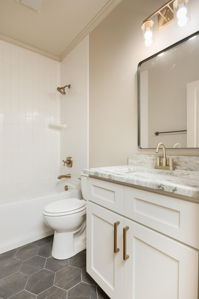 full bathroom featuring toilet, tiled shower / bath, vanity, crown molding, and tile patterned flooring