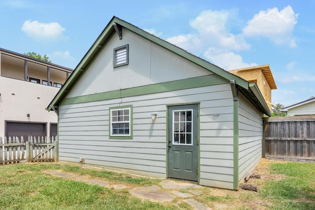 rear view of property with a lawn