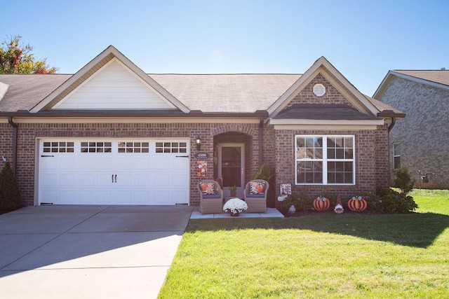 view of front of property with a front lawn and a garage