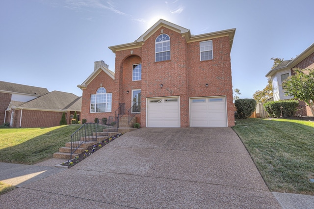 view of front facade with a front yard and a garage