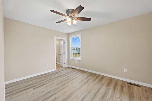 spare room featuring ceiling fan and light hardwood / wood-style flooring