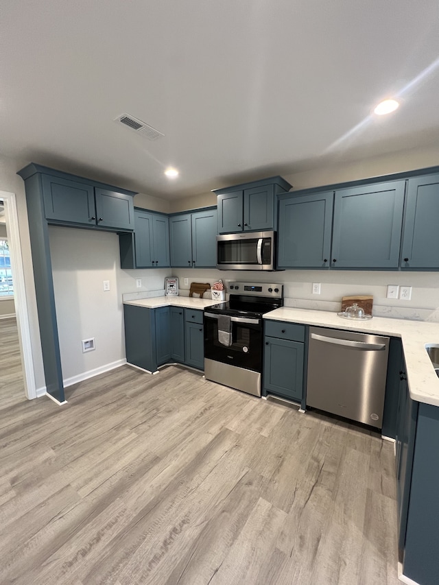 kitchen featuring light hardwood / wood-style floors and stainless steel appliances