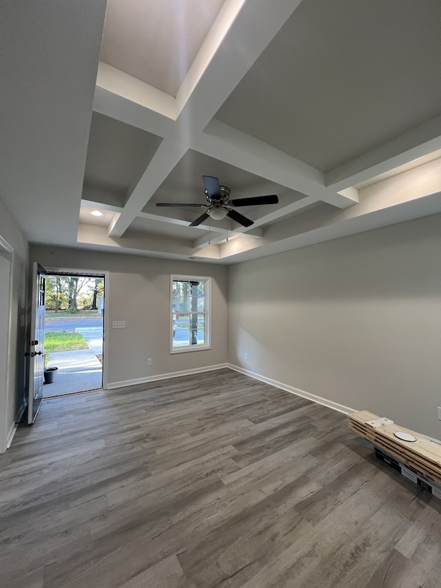 spare room featuring hardwood / wood-style floors, coffered ceiling, and ceiling fan