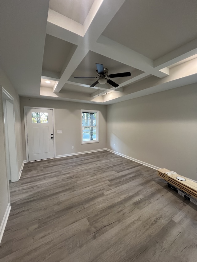 interior space with a wealth of natural light, coffered ceiling, and wood-type flooring