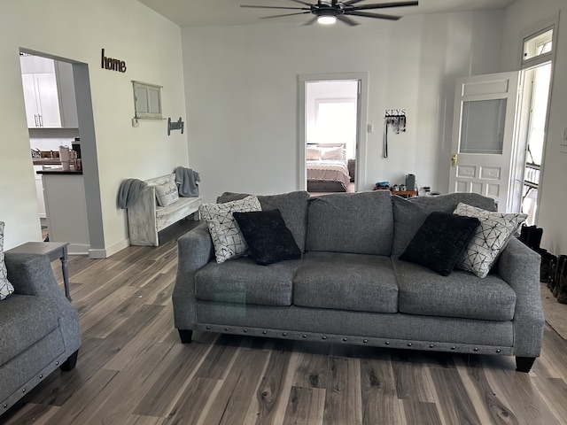 living room featuring hardwood / wood-style flooring and ceiling fan