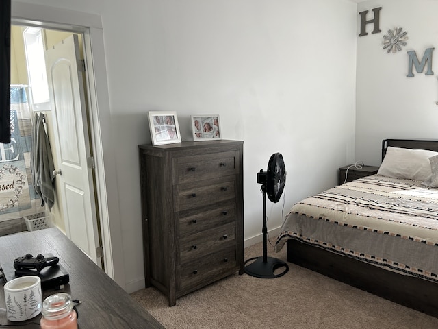 bedroom featuring light carpet