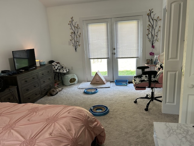 bedroom with french doors and light colored carpet