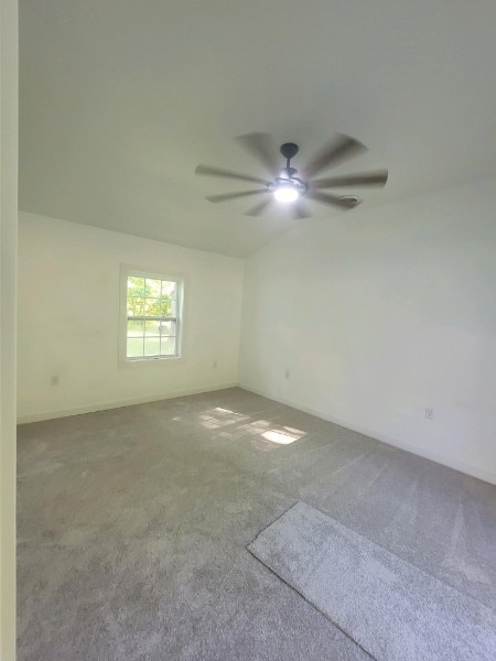 empty room featuring carpet and ceiling fan