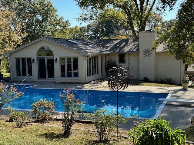 back of house with a patio area