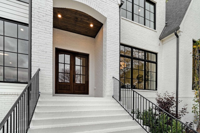 view of exterior entry featuring french doors