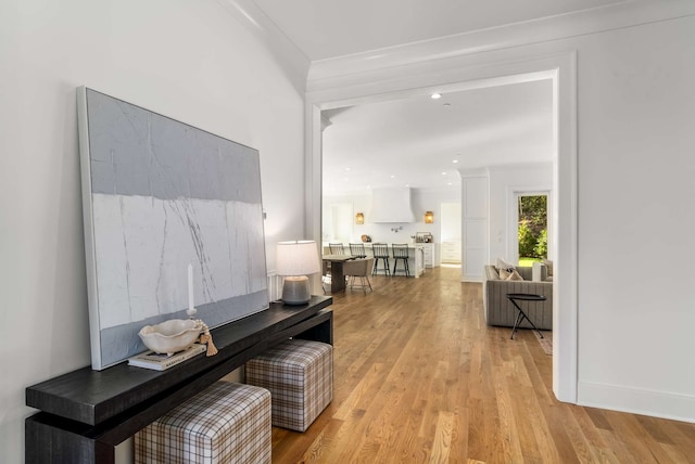 hallway with light hardwood / wood-style floors