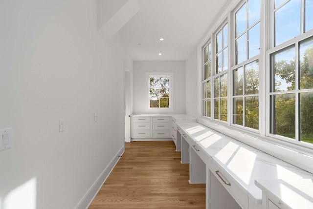 hall with light hardwood / wood-style floors