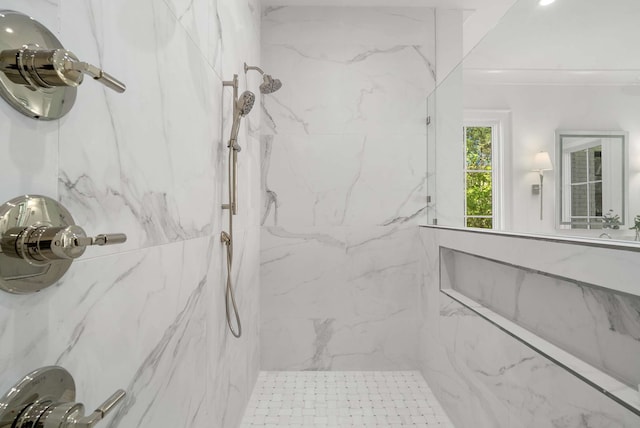 bathroom with tiled shower