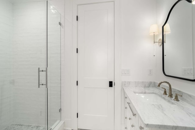 bathroom with vanity and an enclosed shower