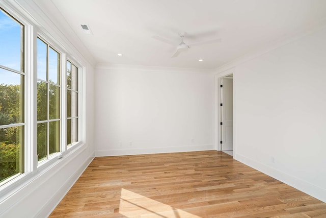 unfurnished room featuring ceiling fan, light wood-type flooring, and a wealth of natural light