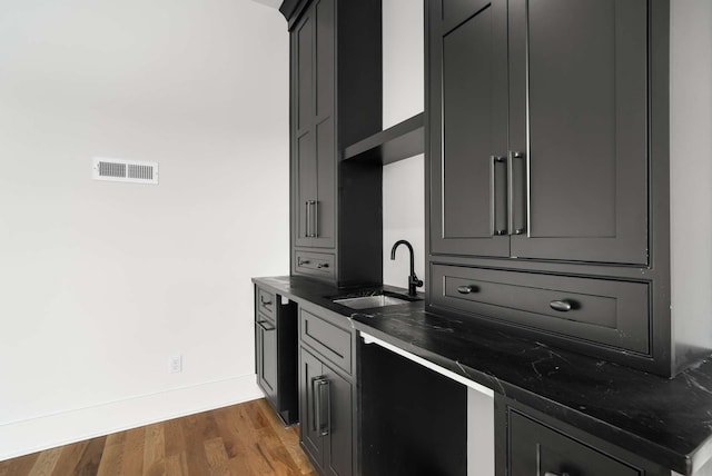 kitchen featuring dark hardwood / wood-style flooring and sink