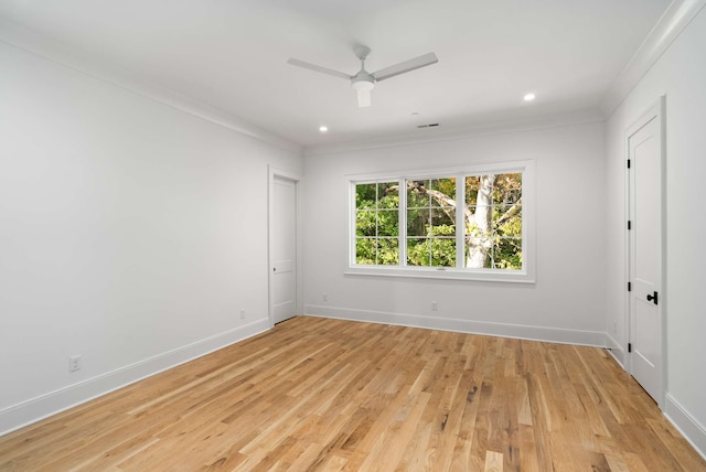 empty room with ceiling fan, ornamental molding, and light hardwood / wood-style flooring