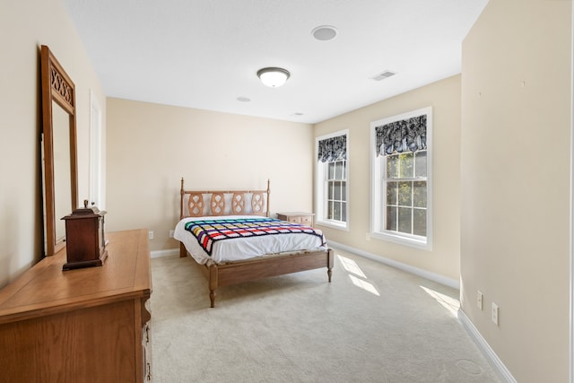 bedroom with light carpet